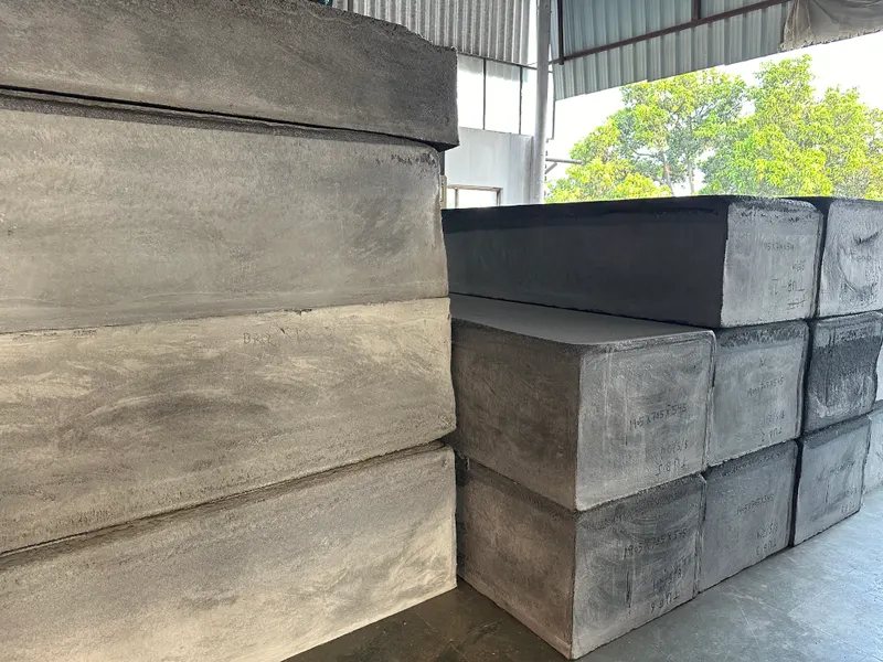 Stacked densified thermally bonded polyester blocks in the warehouse